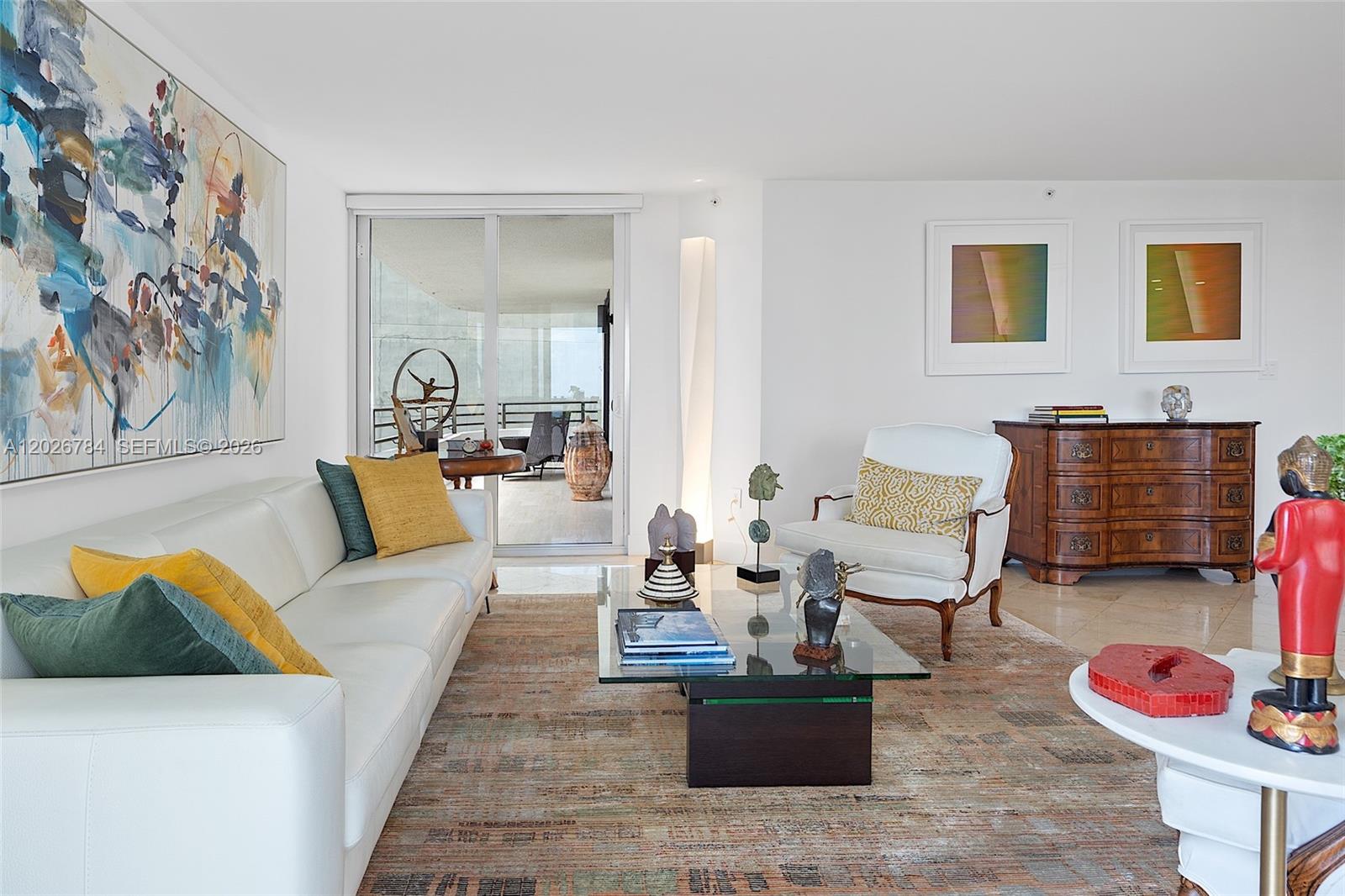 151 Southeast 15th Road, Unit 601 Miami, FL 33129 - Photo 2 of 36 a living room with furniture and a couch