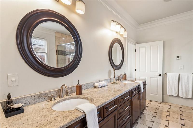 629 Boulevard Northeast Atlanta, GA 30308 - Photo 41 of 74 a bathroom with a granite countertop double vanity and a mirror