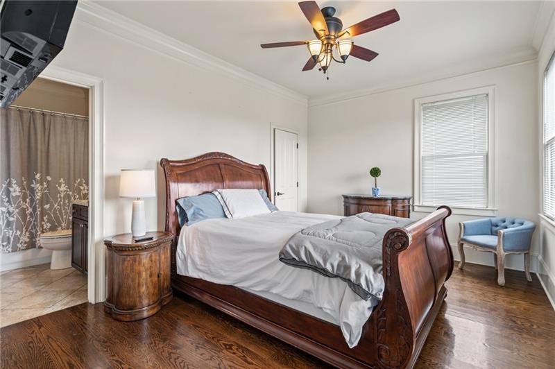 629 Boulevard Northeast Atlanta, GA 30308 - Photo 50 of 74 a bedroom with a bed and a chandelier