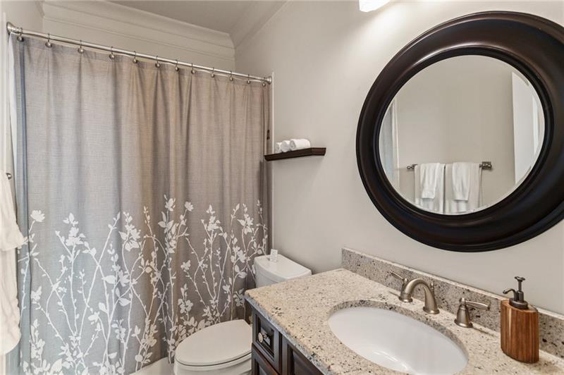 629 Boulevard Northeast Atlanta, GA 30308 - Photo 57 of 74 a bathroom with a sink a toilet and a mirror