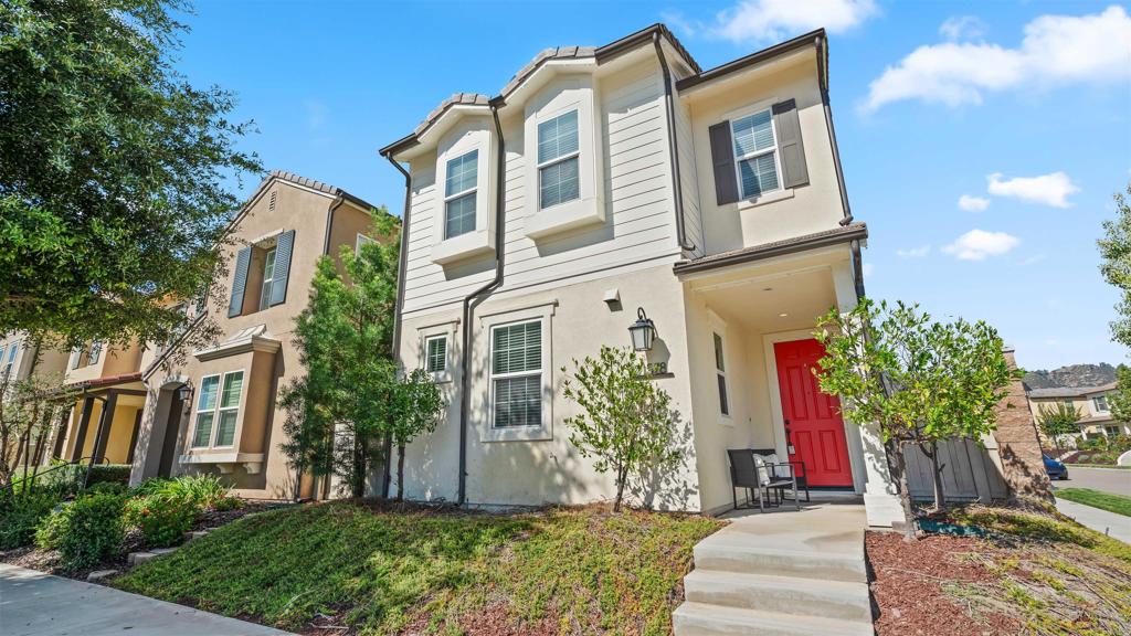 21578 Saddle Bred Lane Escondido, CA 92029 - Photo 1 of 49 a front view of a house with a yard
