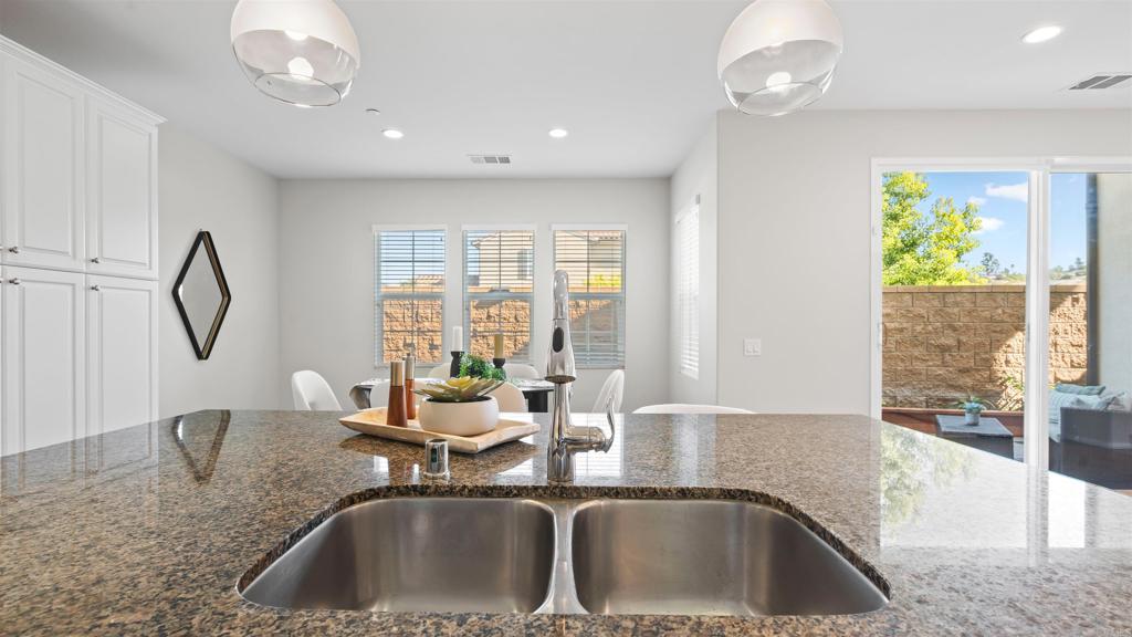21578 Saddle Bred Lane Escondido, CA 92029 - Photo 12 of 49 a kitchen with a sink and a large window