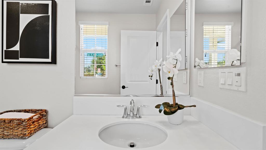 21578 Saddle Bred Lane Escondido, CA 92029 - Photo 17 of 49 a bathroom with a sink and a mirror