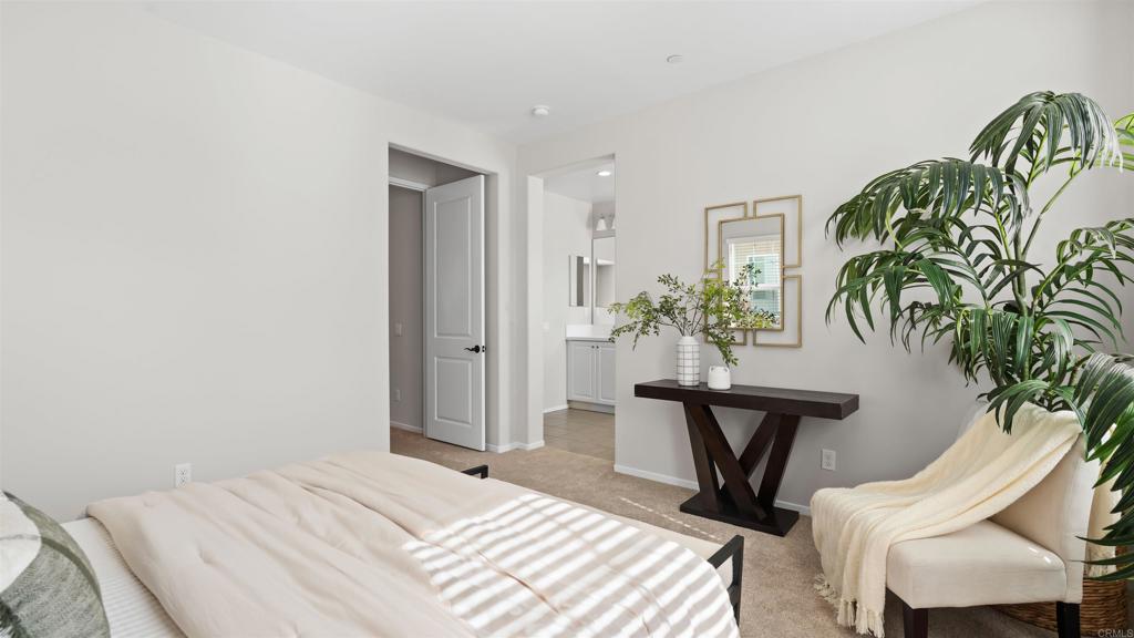 21578 Saddle Bred Lane Escondido, CA 92029 - Photo 23 of 49 a bedroom with a table chair and a potted plant