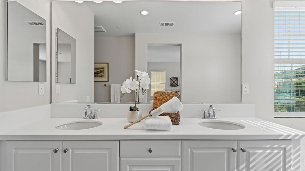 21578 Saddle Bred Lane Escondido, CA 92029 - Photo 24 of 49 a bathroom with double sink and a mirror