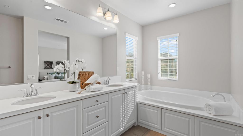21578 Saddle Bred Lane Escondido, CA 92029 - Photo 25 of 49 a bathroom with a sink double vanity granite tub and a mirror