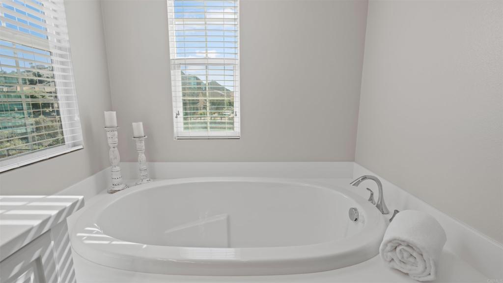 21578 Saddle Bred Lane Escondido, CA 92029 - Photo 26 of 49 a white bath tub sitting in a bathroom next to a window
