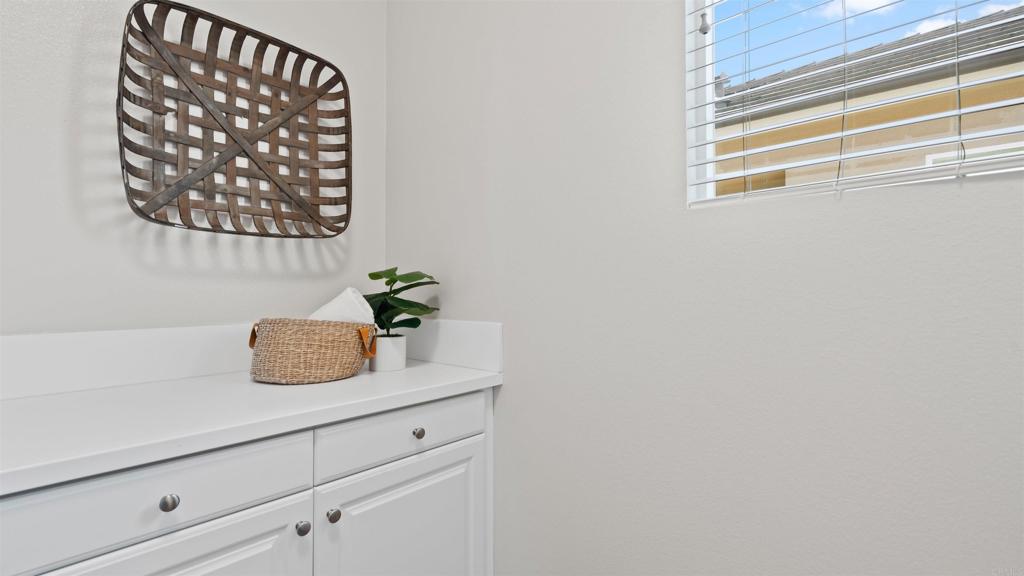 21578 Saddle Bred Lane Escondido, CA 92029 - Photo 31 of 49 a sink with a mirror on it and a window