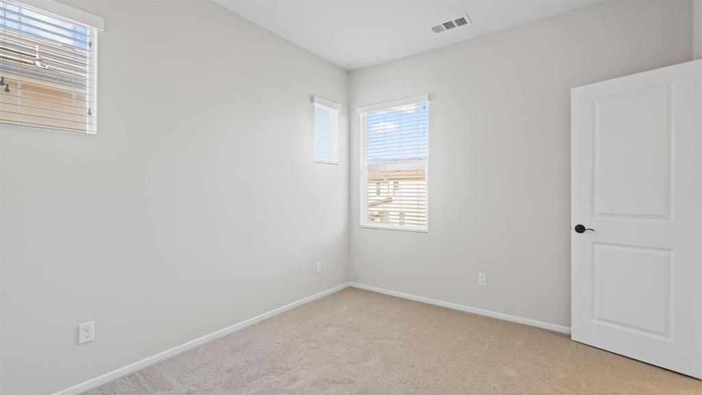 21578 Saddle Bred Lane Escondido, CA 92029 - Photo 32 of 49 an empty room with a window
