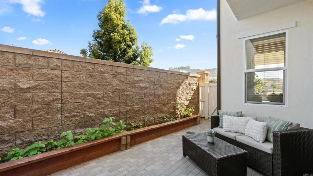 21578 Saddle Bred Lane Escondido, CA 92029 - Photo 37 of 49 a balcony with furniture and a potted plant