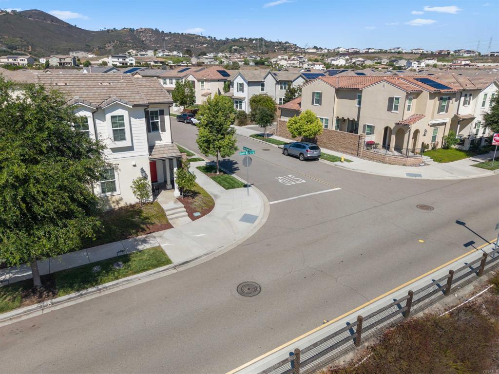21578 Saddle Bred Lane Escondido, CA 92029 - Photo 4 of 49 an aerial view of residential houses and street space