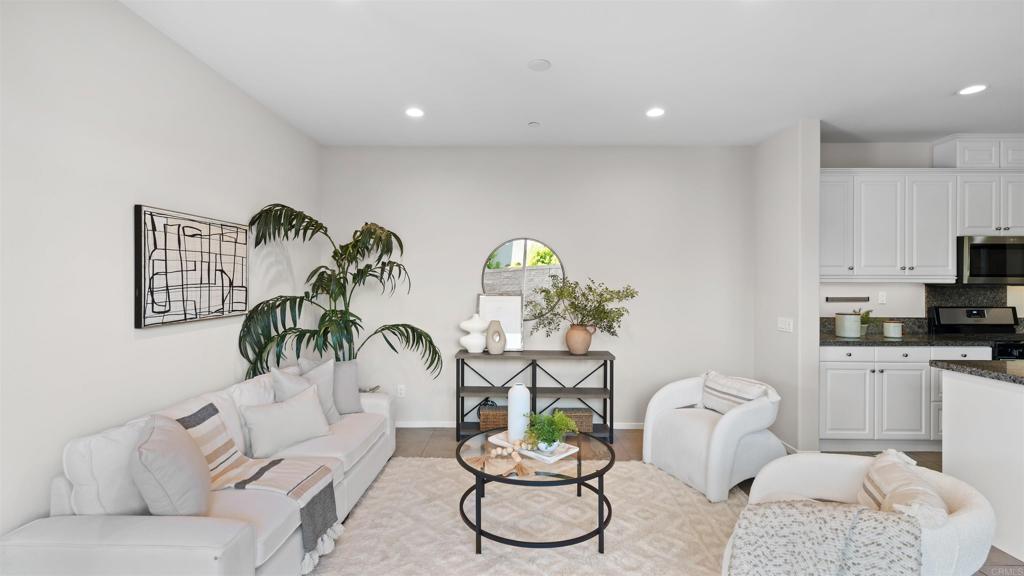 21578 Saddle Bred Lane Escondido, CA 92029 - Photo 7 of 49 a living room with furniture a rug and white walls