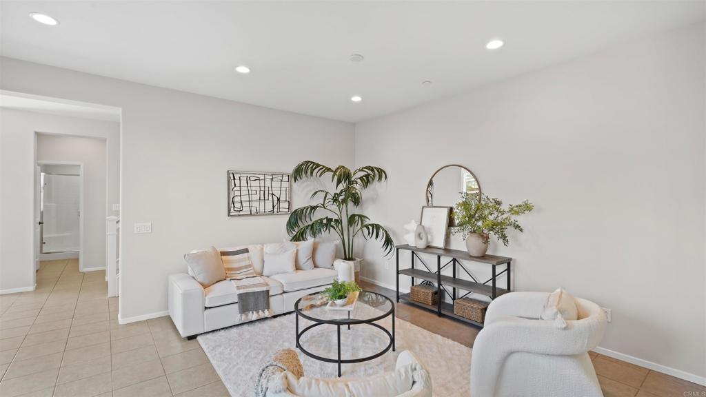 21578 Saddle Bred Lane Escondido, CA 92029 - Photo 8 of 49 a living room with furniture a couch and a potted plant
