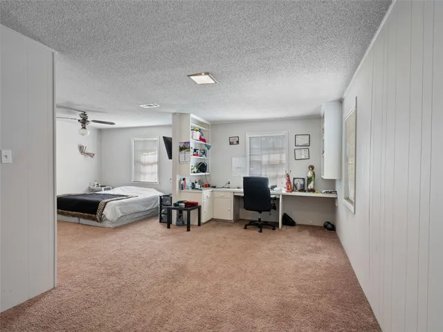 a bedroom with furniture and a window