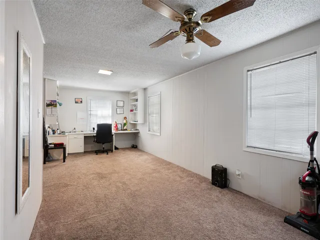 a view of a livingroom with a workspace