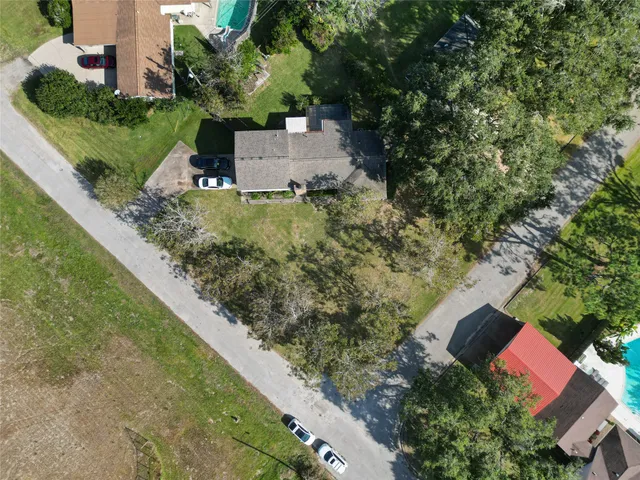 an aerial view of house with yard