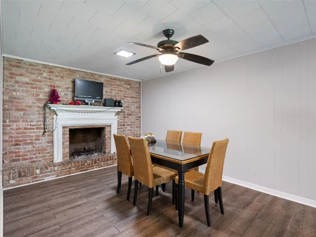 a dining room with furniture and a fireplace