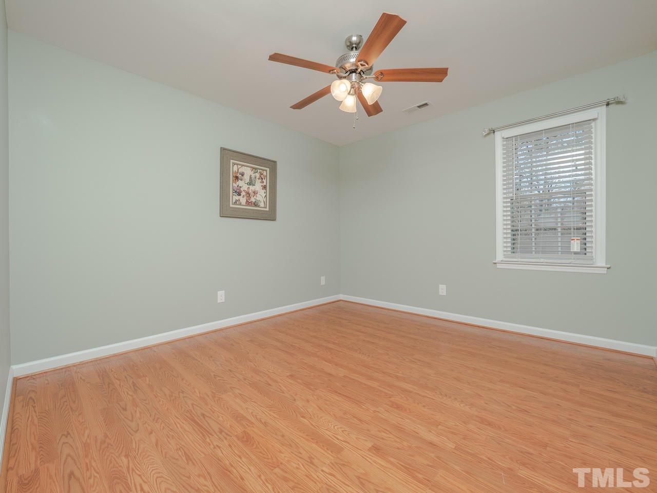 1437 Greenside Drive Raleigh, NC 27609 - Photo 11 of 16 The 2 back bedrooms are spacious and bright.
