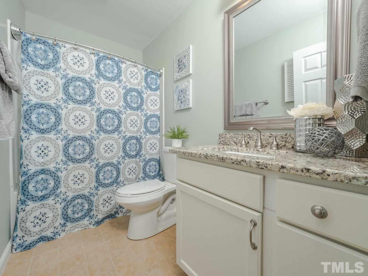 1437 Greenside Drive Raleigh, NC 27609 - Photo 12 of 16 This full bath in the upstairs hall serves the other 2 bedrooms.