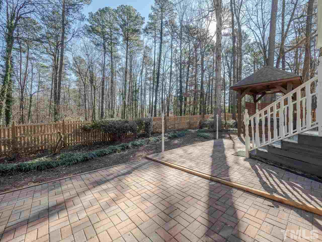 1437 Greenside Drive Raleigh, NC 27609 - Photo 13 of 16 Enjoy the morning sun through the private woods from your expansive patio!