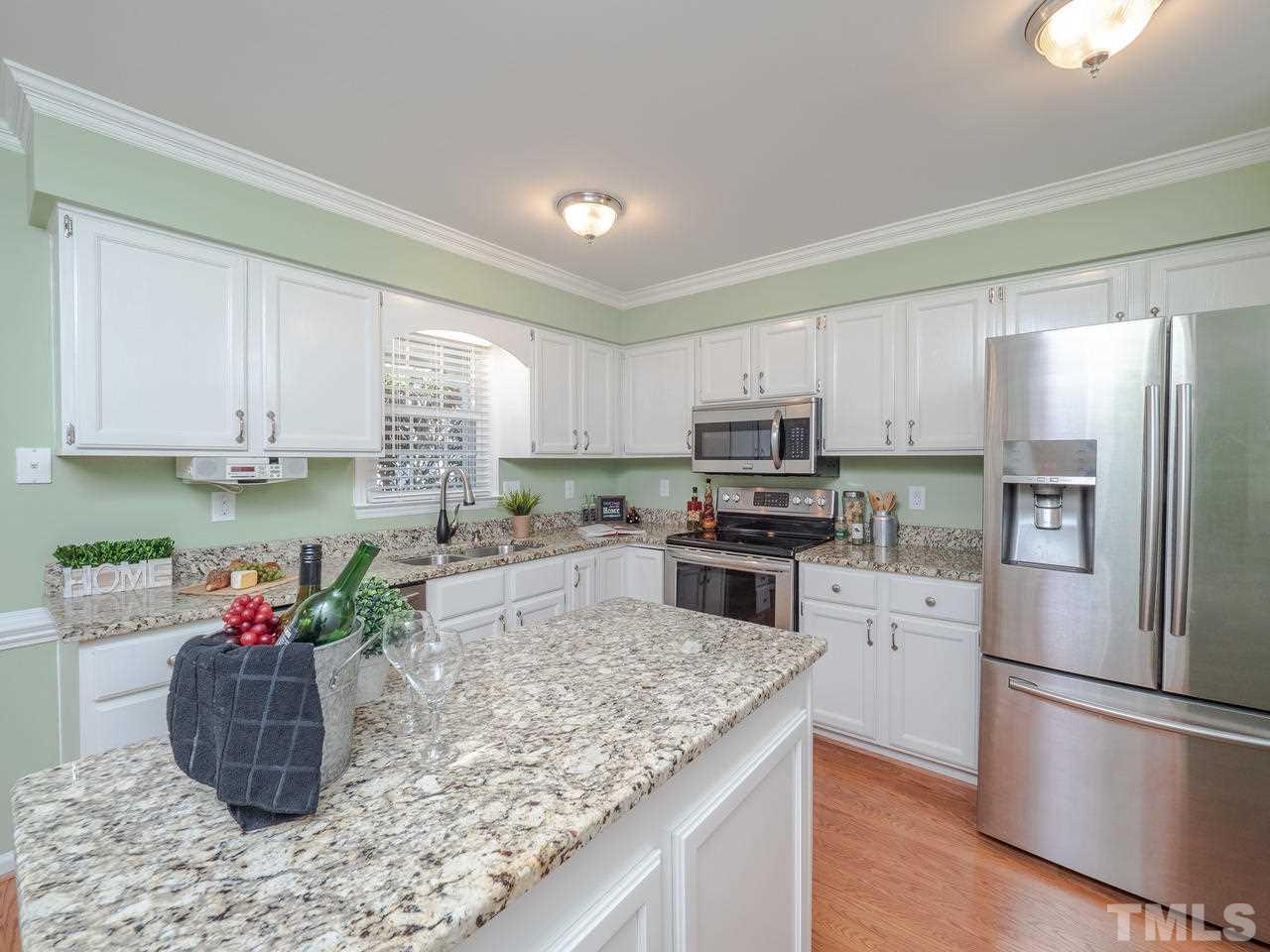 1437 Greenside Drive Raleigh, NC 27609 - Photo 5 of 16 Lots of upgrades make this a practical yet attractive kitchen.