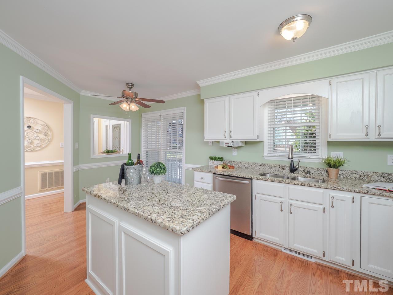 1437 Greenside Drive Raleigh, NC 27609 - Photo 6 of 16 The kitchen layout allows for effective workflow and meal prep.