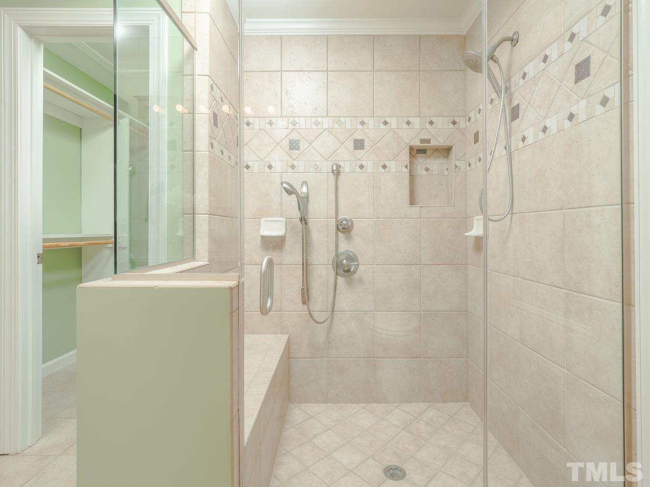 1437 Greenside Drive Raleigh, NC 27609 - Photo 8 of 16 This is the totally upgraded shower in the downstairs Master Bedroom. With access to the backyard and hot tub from the master bathroom, this is a convenient place to clean up.