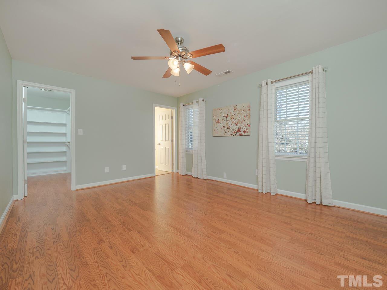 1437 Greenside Drive Raleigh, NC 27609 - Photo 9 of 16 Second Master Bedroom. This is on the second floor in the front of the house. There's access to a walk-in closet and full bath!