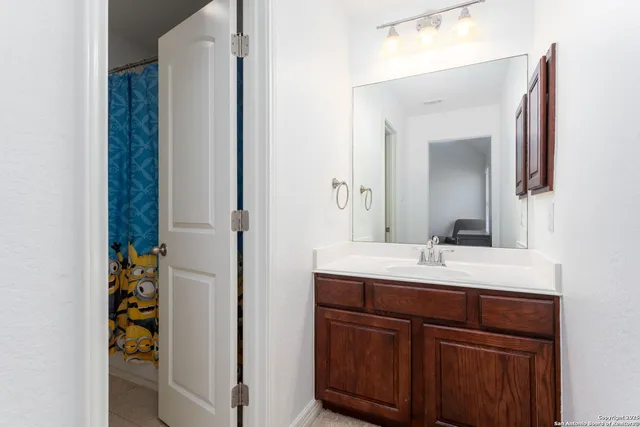 a bathroom with a sink and a mirror