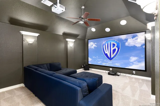 a projector room with a projector and couches