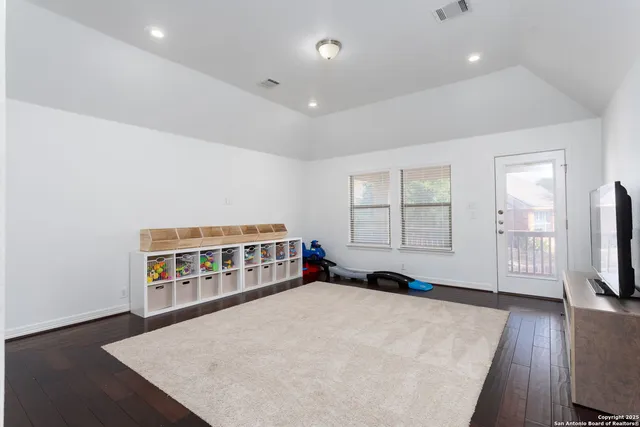 a living room with a couch and a flat screen tv