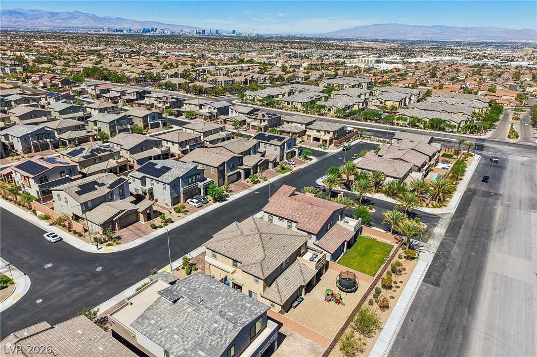 194 Viento Ridge Street Henderson, NV 89012 - Photo 63 of 72 Aerial view showcases a modern suburban neighborhood set against a distant mountain backdrop.