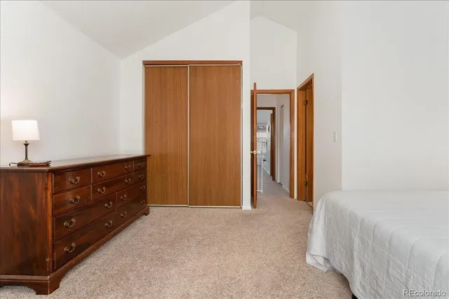 a bathroom with a sink toilet vanity and shower