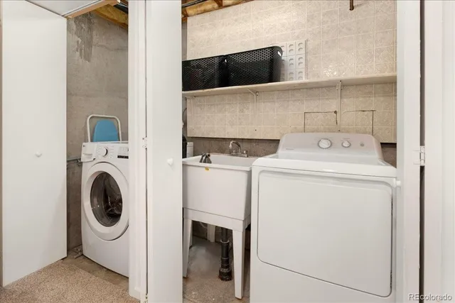 a view of backyard with deck and garden