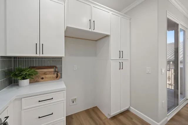a kitchen with a refrigerator and cabinets