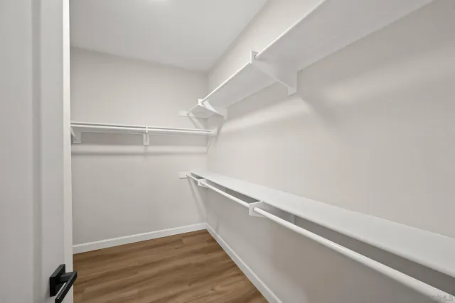 a view of an empty walk in closet