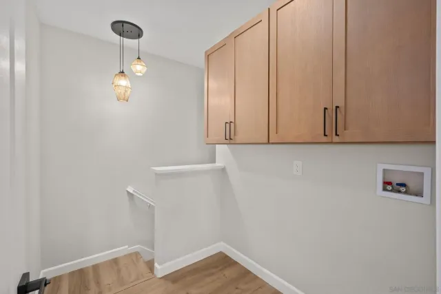 a view of storage and utility room with racks on the wall