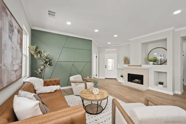 a living room with furniture and a fireplace