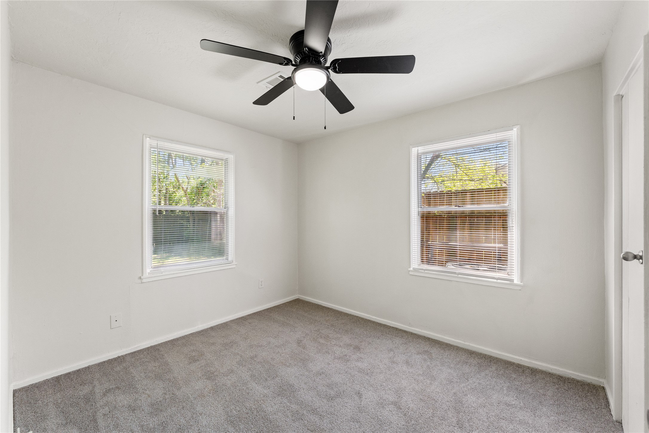 7725 St Lo Road Houston, TX 77033 - Photo 16 of 26 an empty room with a window