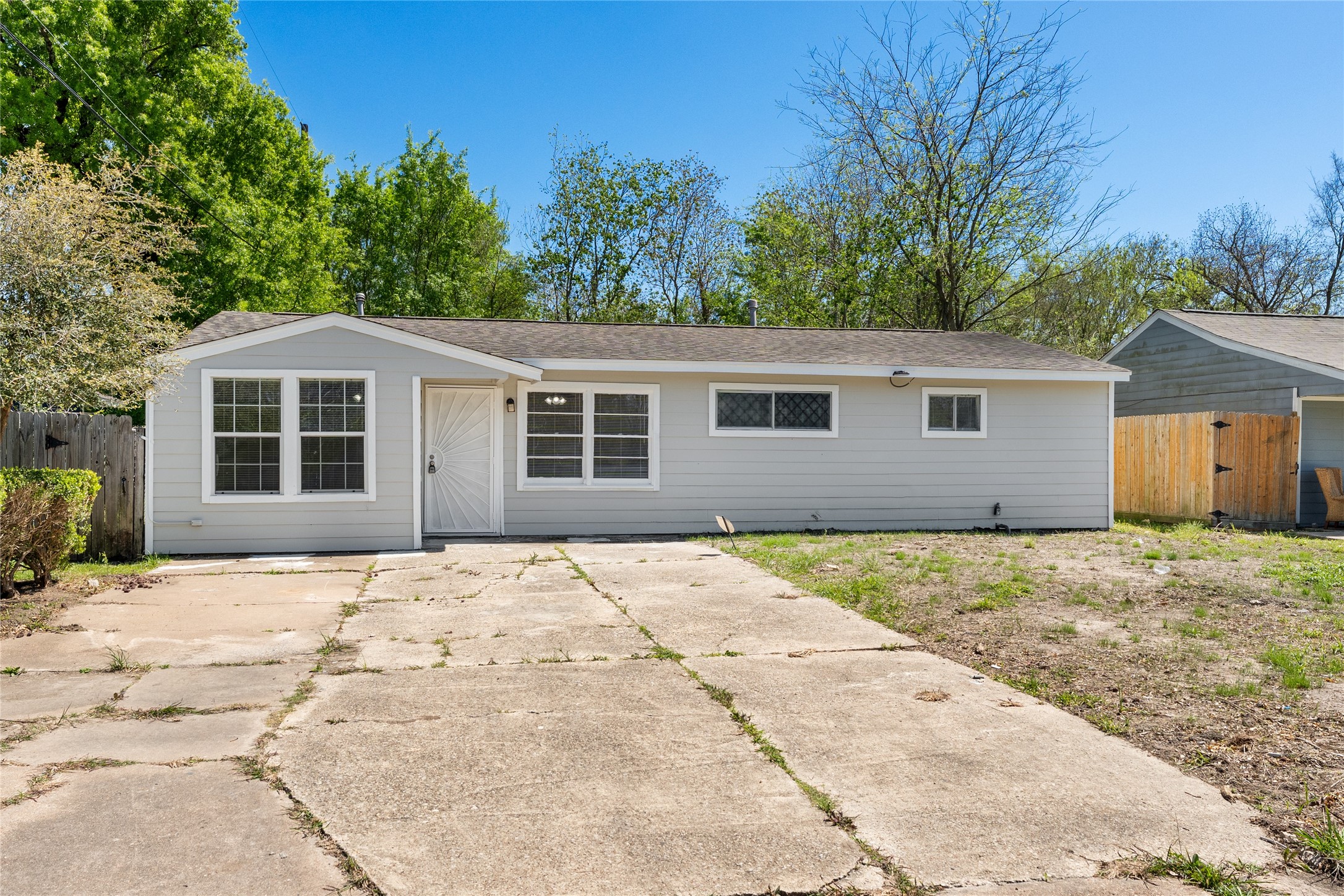 7725 St Lo Road Houston, TX 77033 - Photo 2 of 26 a front view of a house with a yard