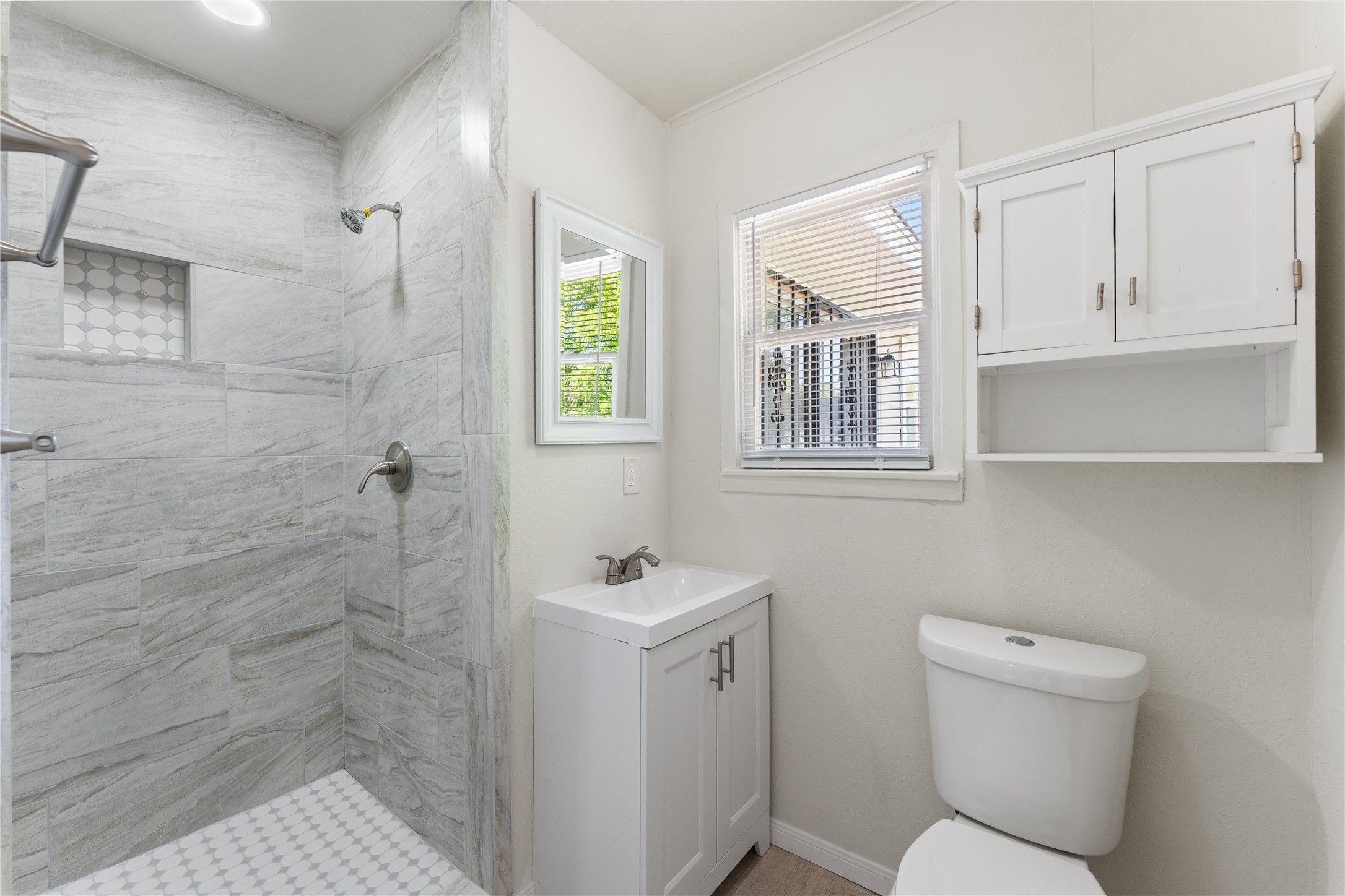 7725 St Lo Road Houston, TX 77033 - Photo 21 of 26 a bathroom with a toilet sink and shower