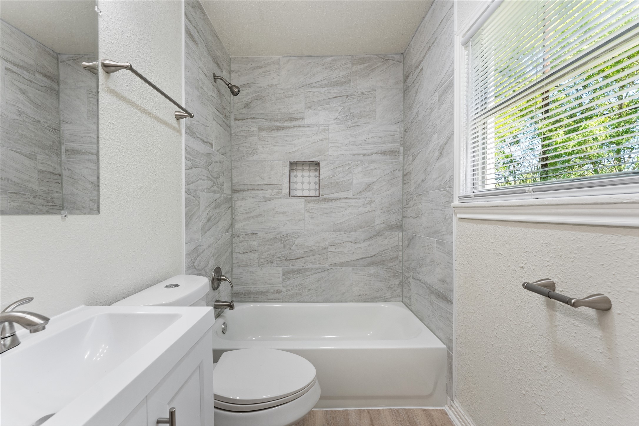 7725 St Lo Road Houston, TX 77033 - Photo 23 of 26 a bathroom with a bathtub shower sink vanity and toilet