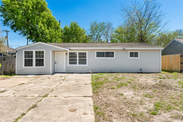 a house with trees in the background