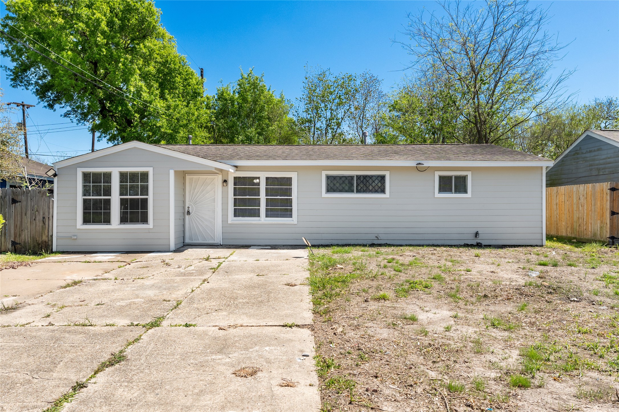 7725 St Lo Road Houston, TX 77033 - Photo 3 of 26 a house with trees in the background