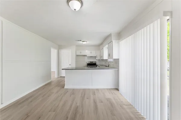 a view of kitchen with wooden floor