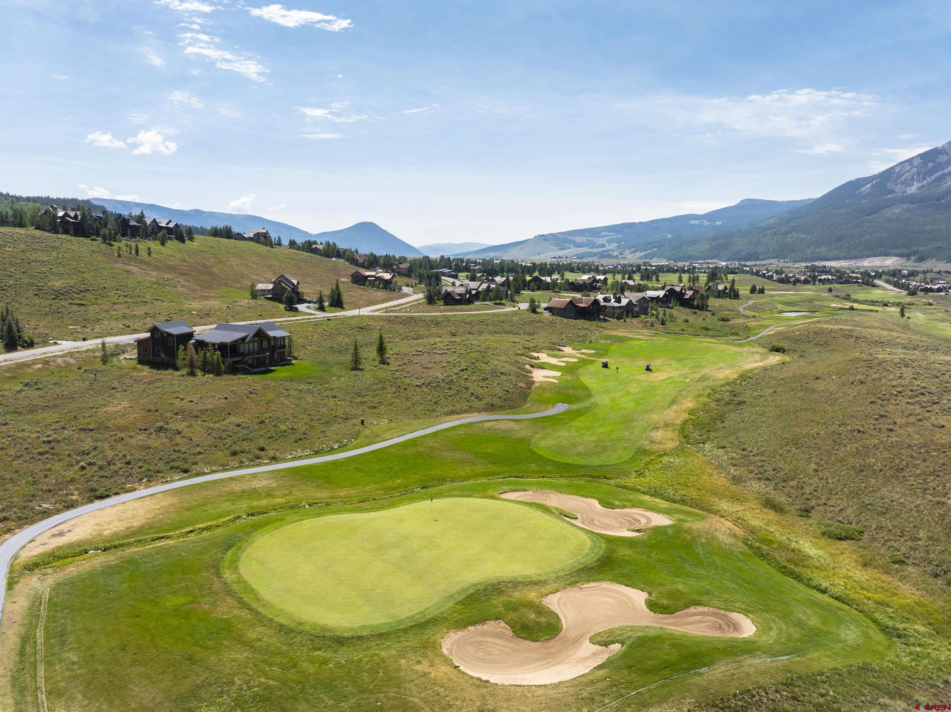 434 Country Club Drive Crested Butte, CO 81224 - Photo 11 of 24 a view of a swimming pool with an ocean view
