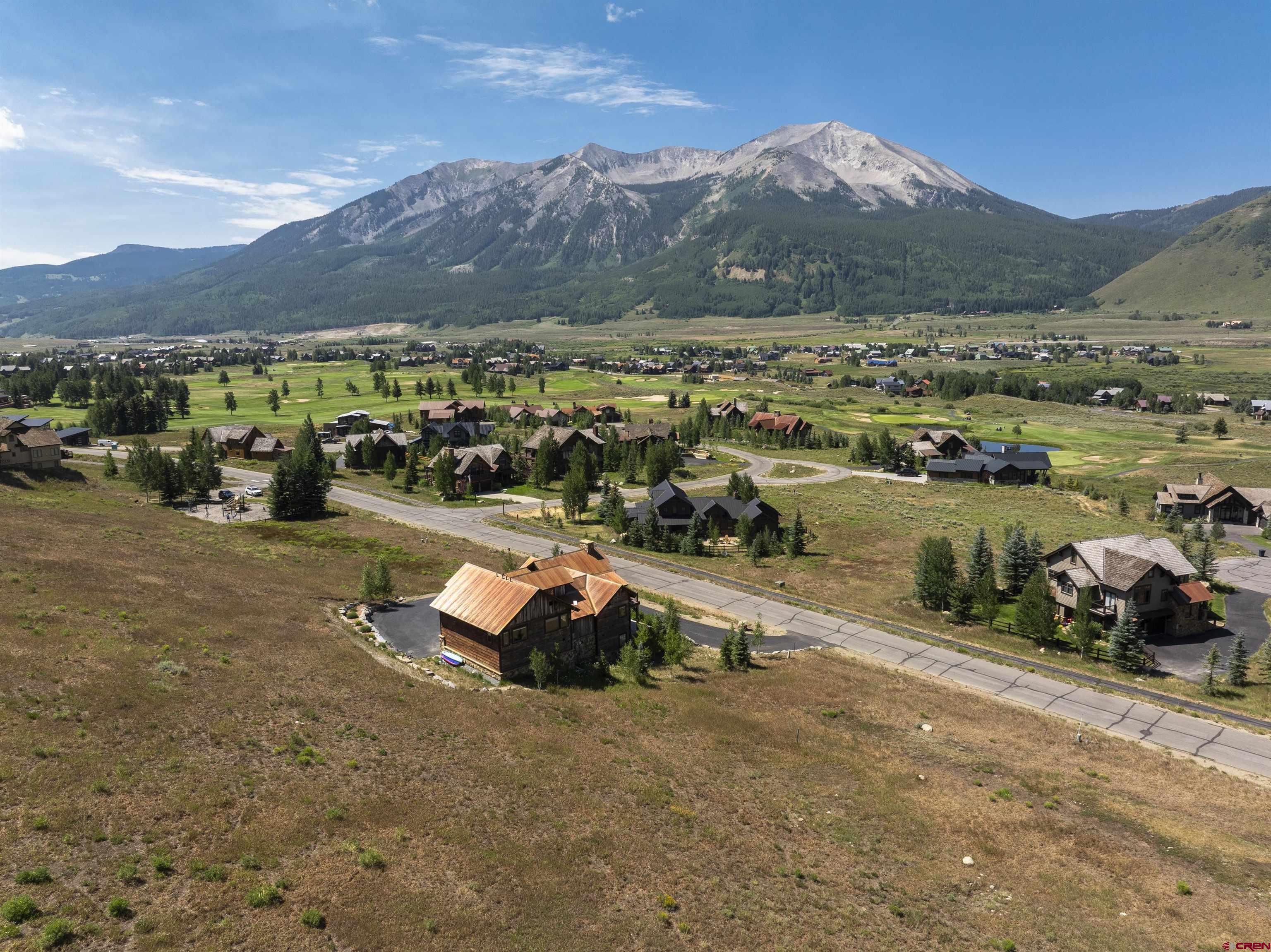 434 Country Club Drive Crested Butte, CO 81224 - Photo 17 of 24 an aerial view of a town with swimming pool and mountains