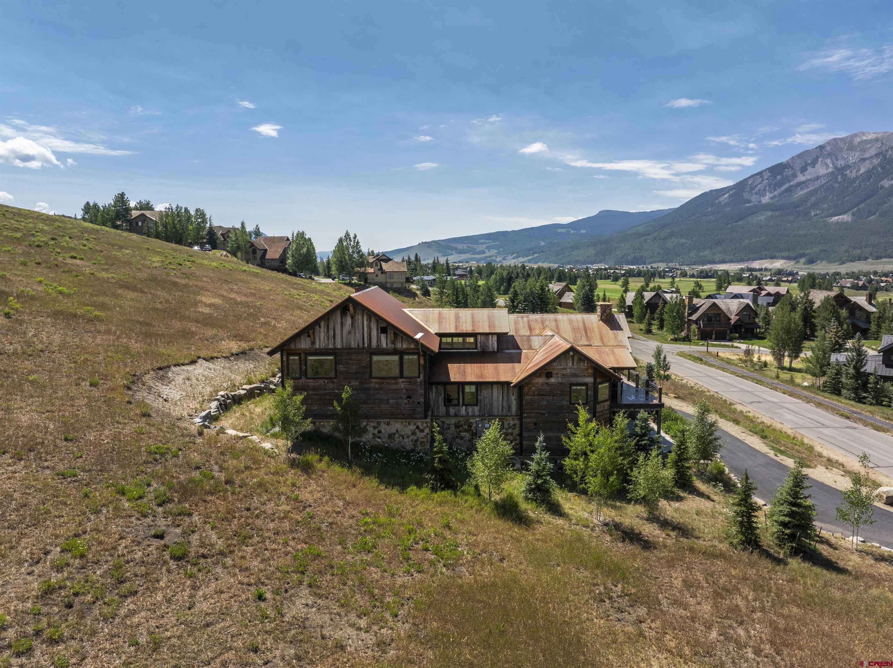 434 Country Club Drive Crested Butte, CO 81224 - Photo 24 of 24 a aerial view of a house with a yard and lake view