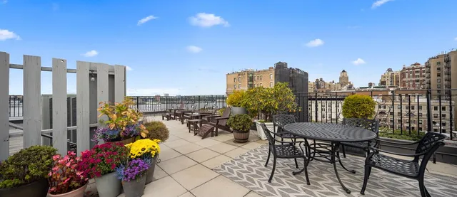 a view of a chairs and table in a patio