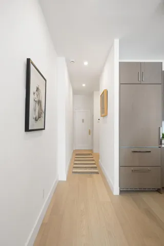 a bathroom with a double vanity sink a mirror and a shower
